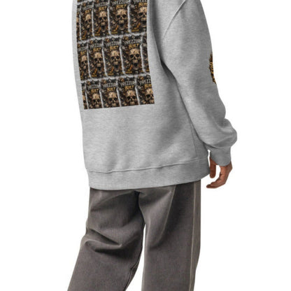 A man wearing a light gray oversized hoodie with a large black, brown, and gold graphic print on the back, paired with gray sweatpants and white sneakers, shown from a rear three-quarter view on a white background.